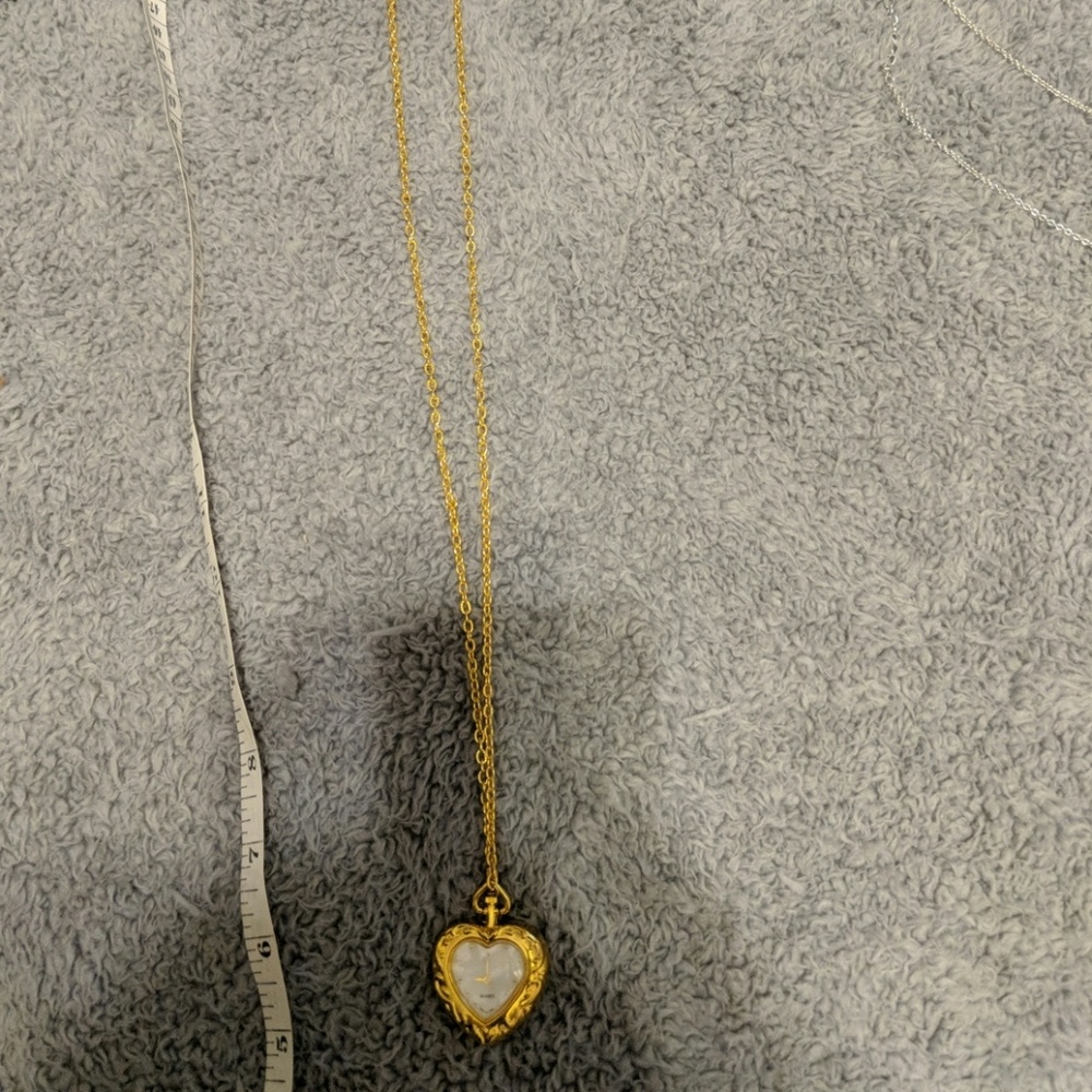 Gold clock necklace